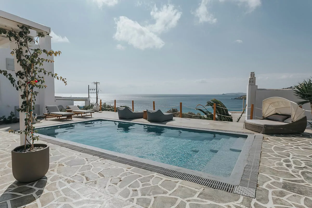 Private 2-Villas Complex for Rent in Mykonos | Platis Gialos | REF: 180413063 | CODE: PLG-5 | 2 Private Infinity Pools | Sea & Sunset View | Sleeps 22 | 11 Bedrooms | 7 Bathrooms